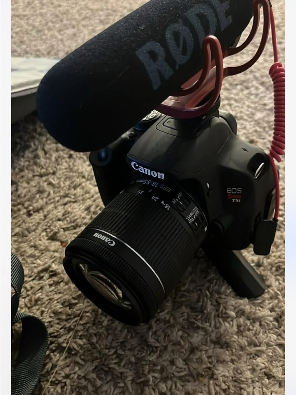Canon Black DSLR Camera with Rode Microphone and Black Zoom Lens